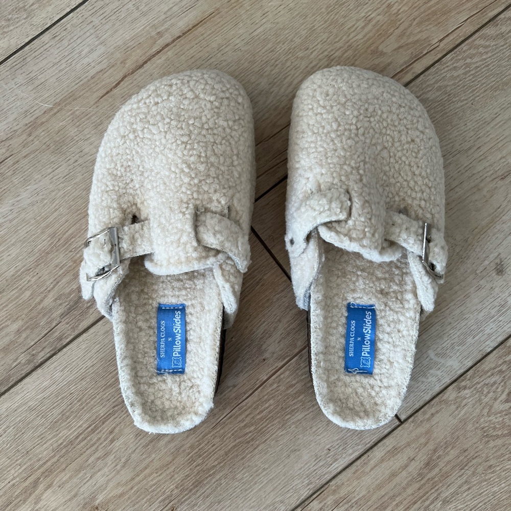 PillowSlides slipper clogs faux shearling. Adjustable buckle. Cork/rubber sole.